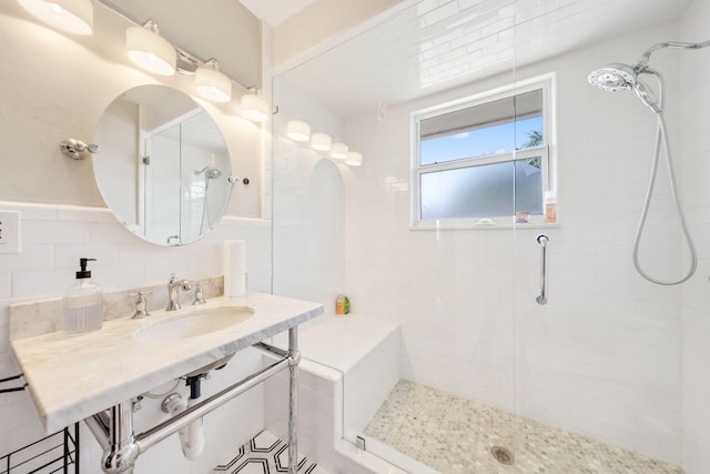442 SE 17th Ter, Deerfield Beach, FL 33441 - bathroom featuring a sink, tile walls, and tiled shower