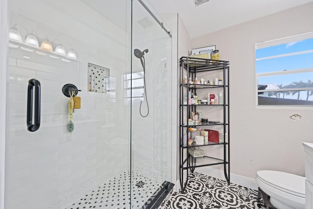 442 SE 17th Ter, Deerfield Beach, FL 33441 - full bath with tile patterned floors, toilet, tiled shower, and baseboards