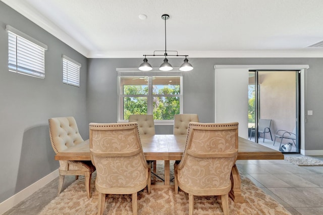 6449 NW Castlebrook Ave, Port Saint Lucie, FL 34983 - dining area featuring baseboards, ornamental molding, and visible vents