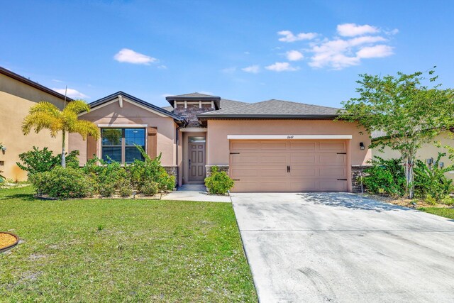 6449 NW Castlebrook Ave, Port Saint Lucie, FL 34983 - prairie-style house with driveway, a front yard, an attached garage, stone siding, and stucco siding