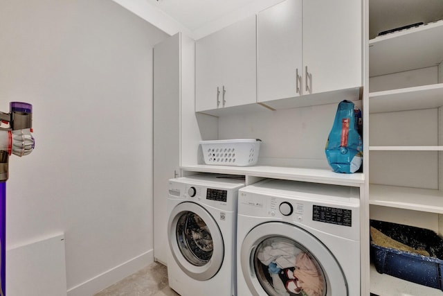 6449 NW Castlebrook Ave, Port Saint Lucie, FL 34983 - laundry area featuring separate washer and dryer, cabinet space, and baseboards
