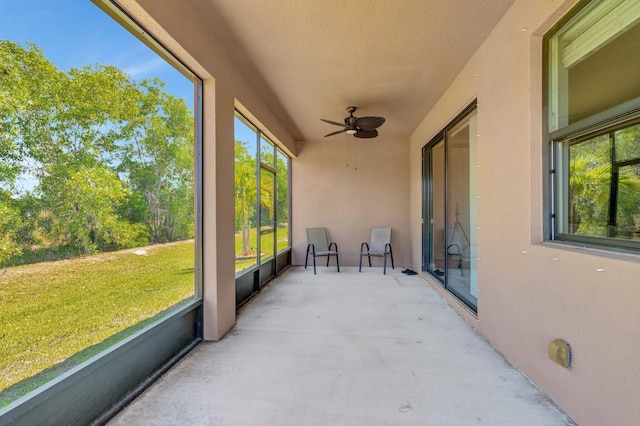 6449 NW Castlebrook Ave, Port Saint Lucie, FL 34983 - unfurnished sunroom featuring a ceiling fan