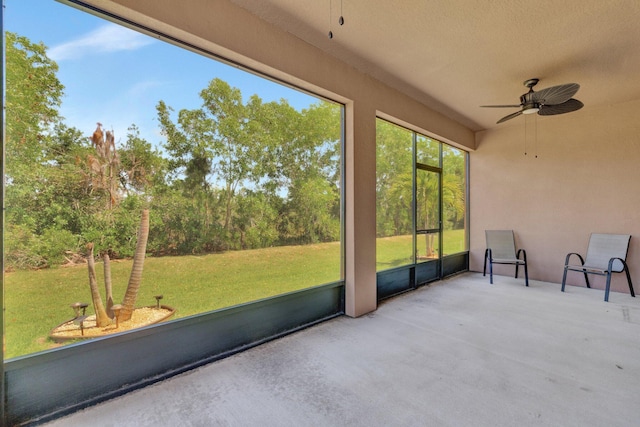 6449 NW Castlebrook Ave, Port Saint Lucie, FL 34983 - unfurnished sunroom featuring a ceiling fan