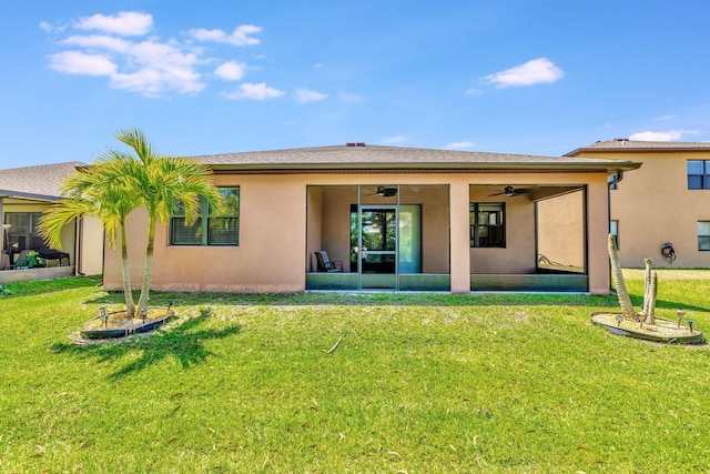 6449 NW Castlebrook Ave, Port Saint Lucie, FL 34983 - rear view of property featuring a lawn, a ceiling fan, a sunroom, and stucco siding