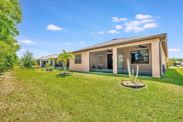 6449 NW Castlebrook Ave, Port Saint Lucie, FL 34983 - back of property with a sunroom, ceiling fan, a yard, and stucco siding
