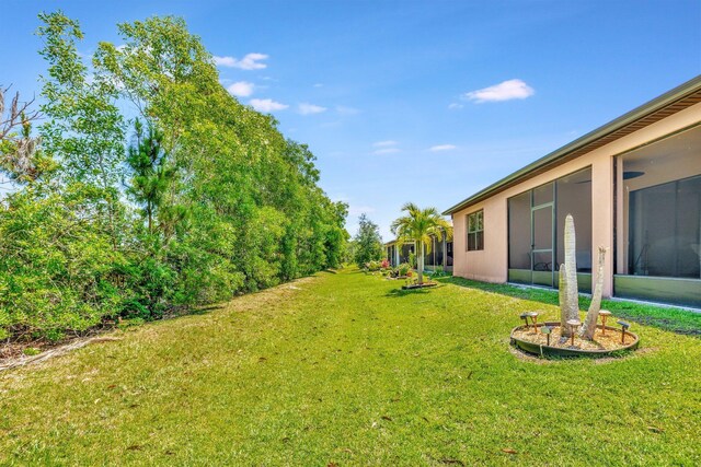 6449 NW Castlebrook Ave, Port Saint Lucie, FL 34983 - view of yard featuring a sunroom