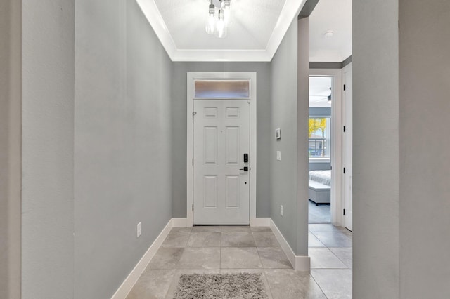 6449 NW Castlebrook Ave, Port Saint Lucie, FL 34983 - entryway featuring baseboards, crown molding, and light tile patterned flooring