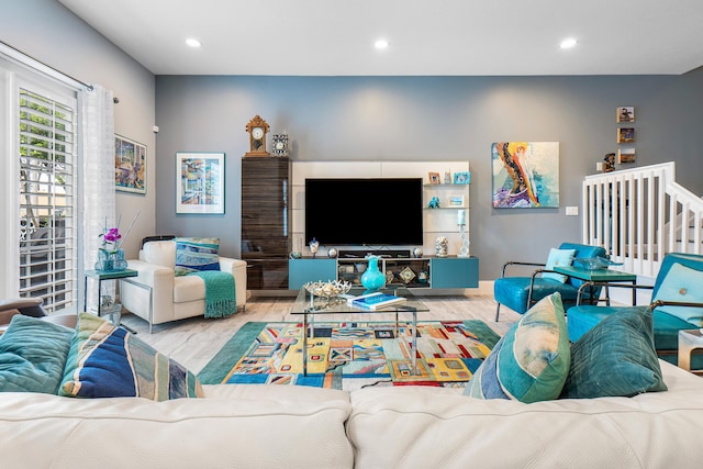 living room with recessed lighting and wood finished floors