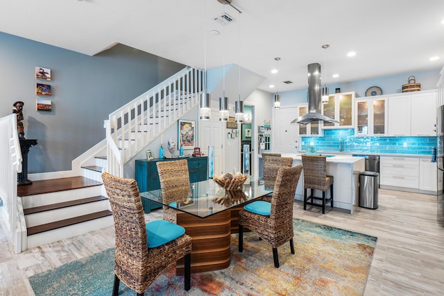 dining area with recessed lighting, stairs, visible vents, and light wood-style flooring