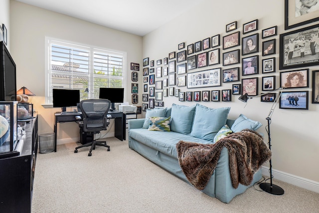 carpeted office featuring baseboards