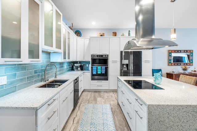 kitchen with double oven, fridge with ice dispenser, island exhaust hood, a sink, and black electric stovetop