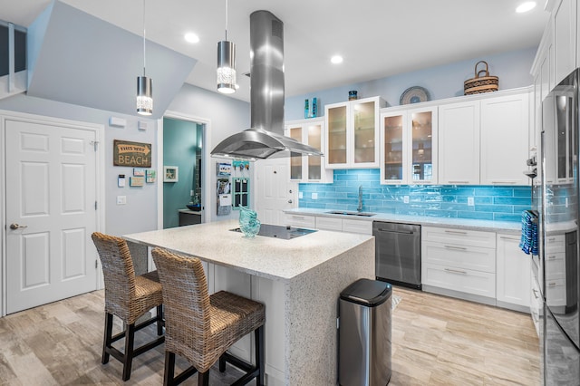 kitchen with a kitchen island, black electric cooktop, island range hood, dishwasher, and a sink