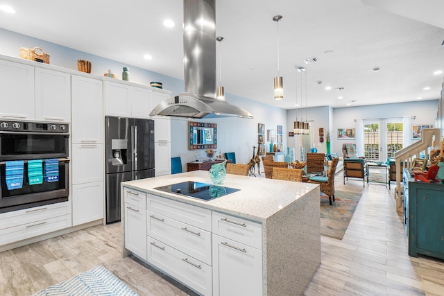 kitchen featuring double oven, fridge with ice dispenser, a kitchen island, island range hood, and black electric cooktop