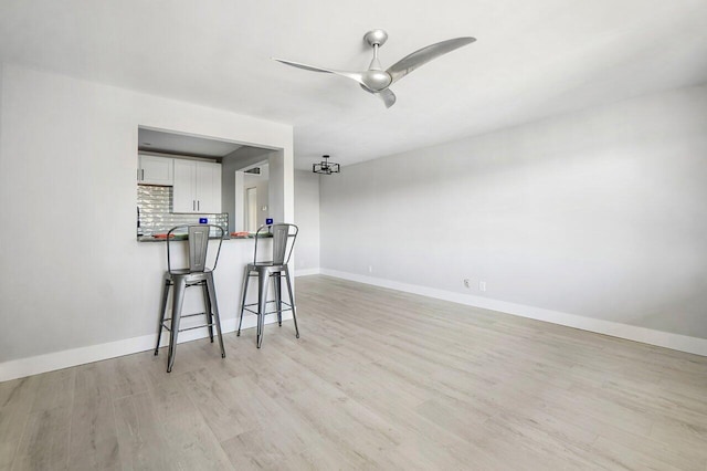 400 Village Green Cir W Unit 310, Palm Springs, FL 33461 - interior space featuring light wood finished floors, baseboards, and ceiling fan