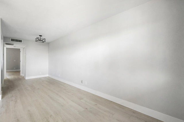400 Village Green Cir W Unit 310, Palm Springs, FL 33461 - unfurnished room featuring light wood-type flooring, visible vents, and baseboards