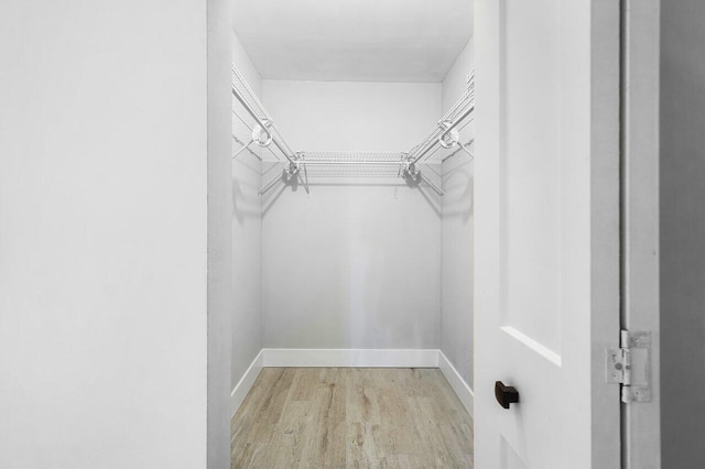400 Village Green Cir W Unit 310, Palm Springs, FL 33461 - spacious closet featuring wood finished floors