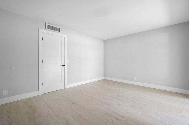 400 Village Green Cir W Unit 310, Palm Springs, FL 33461 - unfurnished room featuring visible vents, wood finished floors, and baseboards