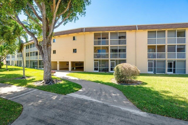 400 Village Green Cir W Unit 310, Palm Springs, FL 33461 - unfurnished room featuring visible vents, wood finished floors, and baseboards