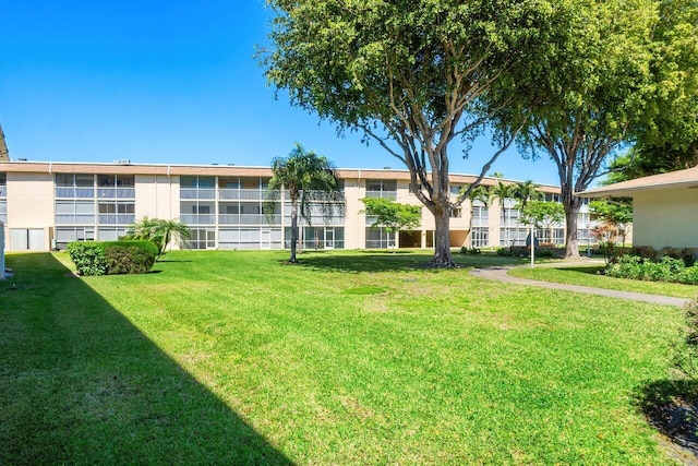 400 Village Green Cir W Unit 310, Palm Springs, FL 33461 - view of home's community featuring a yard