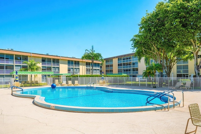 400 Village Green Cir W Unit 310, Palm Springs, FL 33461 - pool with fence and a patio area