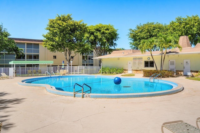 400 Village Green Cir W Unit 310, Palm Springs, FL 33461 - community pool featuring fence