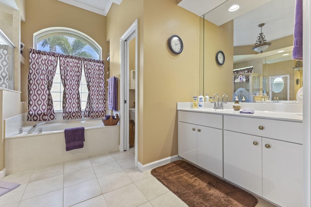 bathroom featuring a bath, a wealth of natural light, tile patterned flooring, and vanity