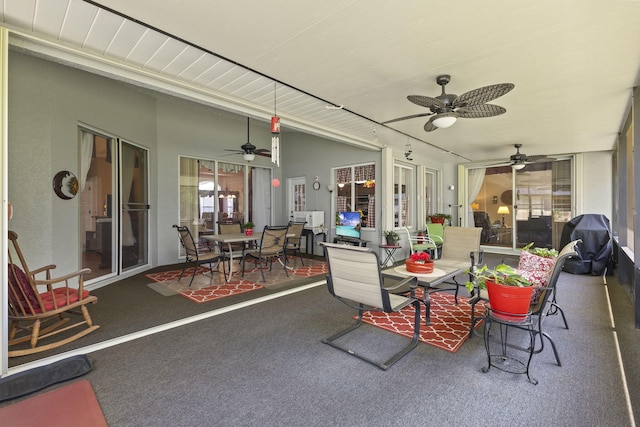 view of patio featuring a grill and a ceiling fan