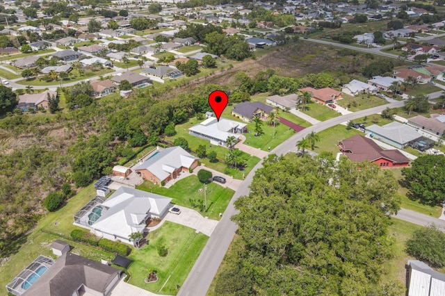 birds eye view of property with a residential view
