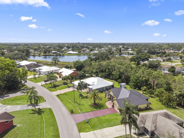 bird's eye view with a water view and a residential view