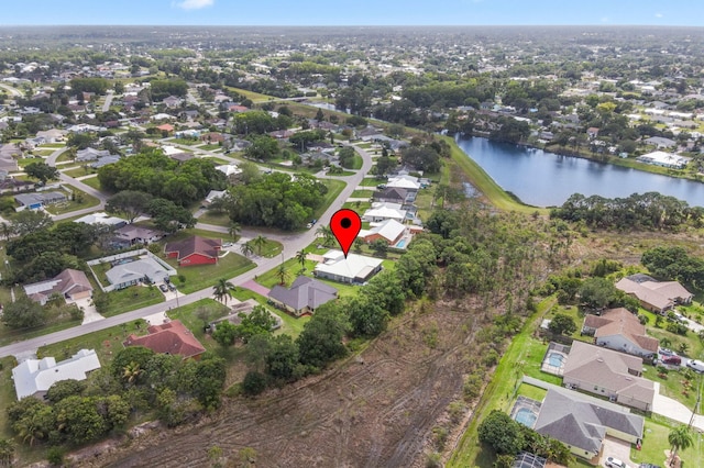 bird's eye view featuring a residential view and a water view