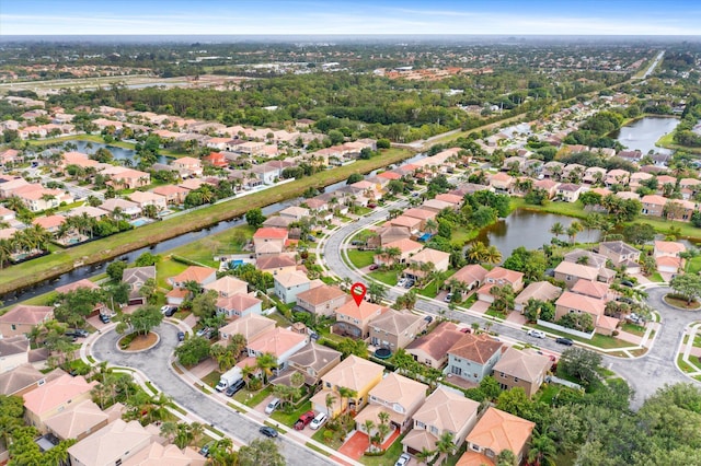 aerial view with a water view and a residential view