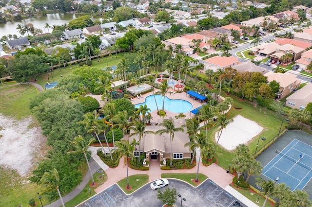 drone / aerial view featuring a residential view and a water view