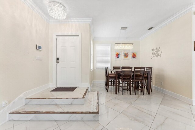 dining area with crown molding, an inviting chandelier, baseboards, and visible vents