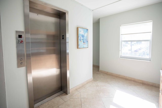 1850 S Ocean Dr Unit 318, Fort Lauderdale, FL 33316 - hallway featuring light tile patterned floors, baseboards, and elevator