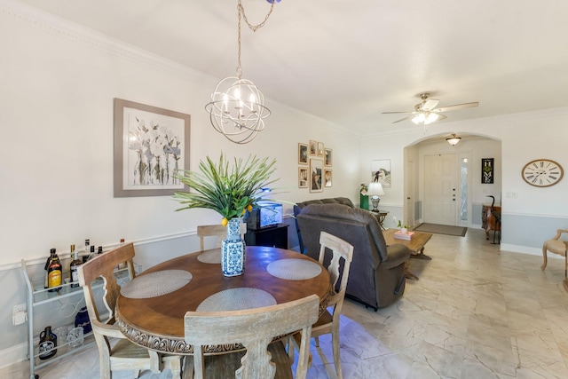273 River Bluff Ln, Royal Palm Beach, FL 33411 - dining space featuring arched walkways, light marble finish flooring, crown molding, ceiling fan, and a chandelier