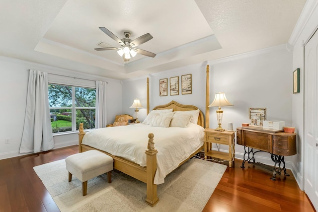 273 River Bluff Ln, Royal Palm Beach, FL 33411 - bedroom featuring a tray ceiling, wood finished floors, a ceiling fan, ornamental molding, and baseboards