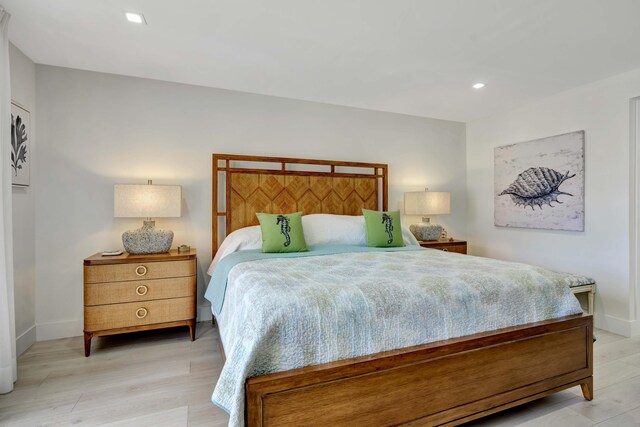 bedroom featuring recessed lighting, light wood finished floors, and baseboards