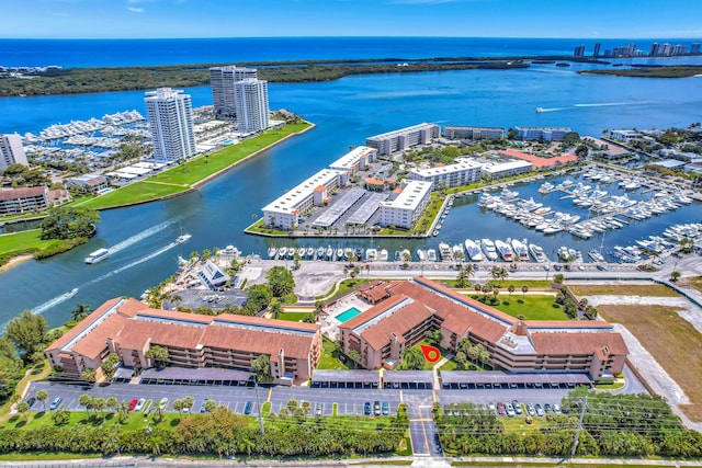 birds eye view of property with a water view