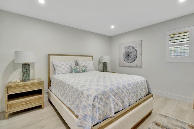 bedroom featuring baseboards, recessed lighting, and wood finished floors