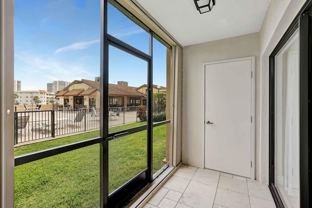 unfurnished sunroom featuring plenty of natural light