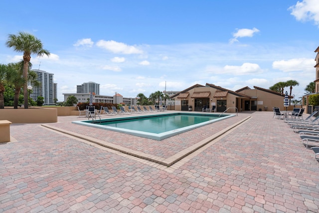 pool featuring a patio area