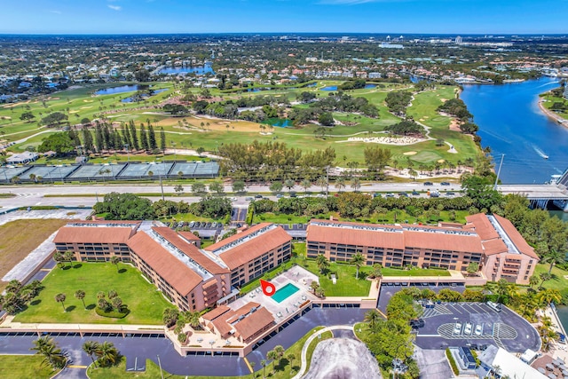 drone / aerial view featuring a water view and golf course view