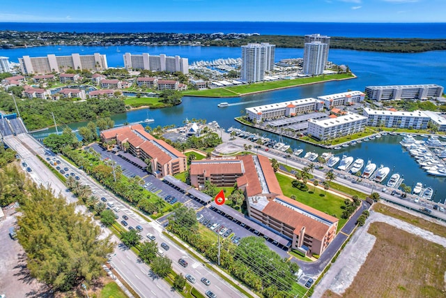 drone / aerial view with a water view and a view of city
