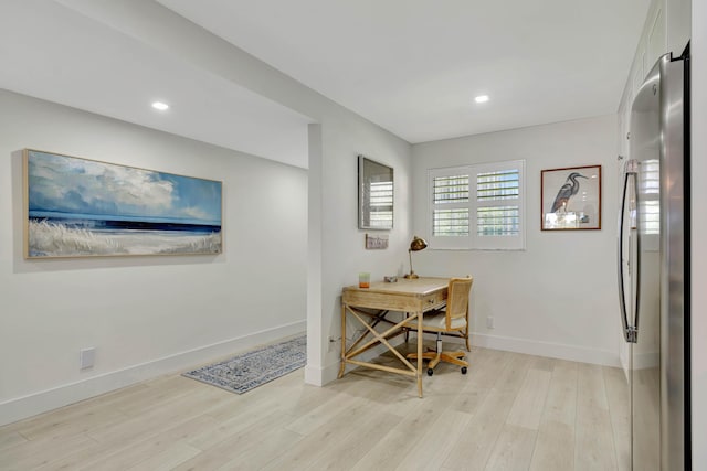 office area featuring recessed lighting, baseboards, and light wood finished floors