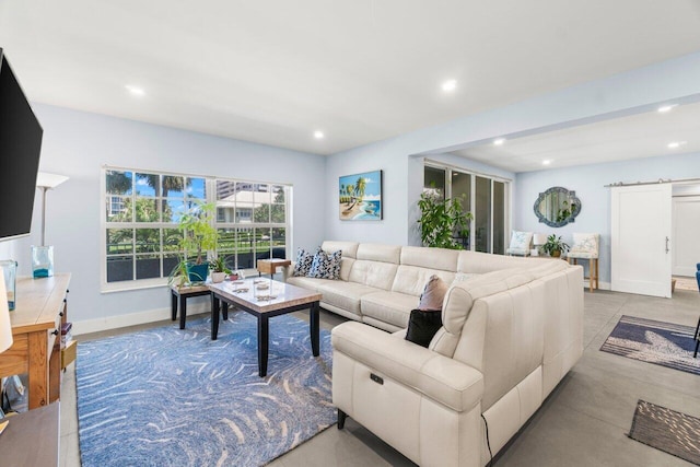 living room featuring baseboards and recessed lighting
