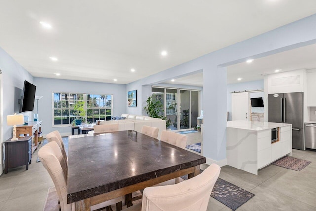 dining space featuring recessed lighting