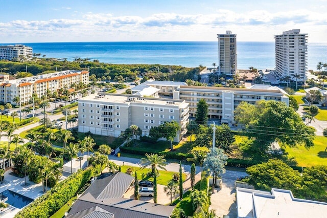 bird's eye view featuring a water view and a city view