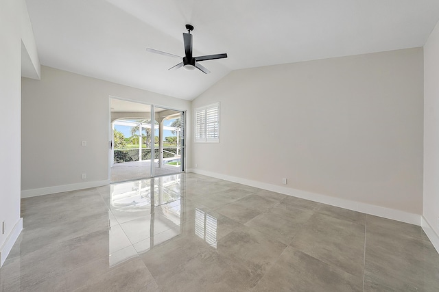 spare room with baseboards, ceiling fan, and lofted ceiling
