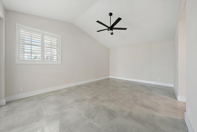 additional living space with concrete flooring, ceiling fan, baseboards, and lofted ceiling