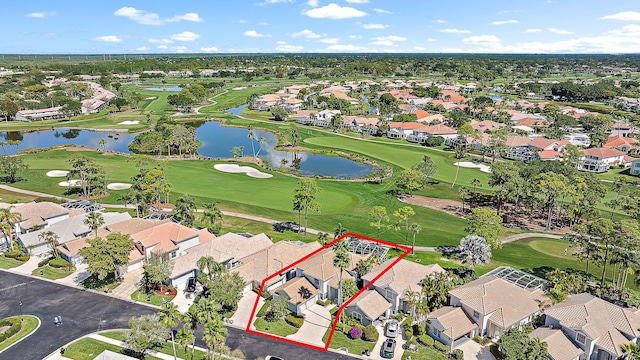 bird's eye view featuring a water view, golf course view, and a residential view
